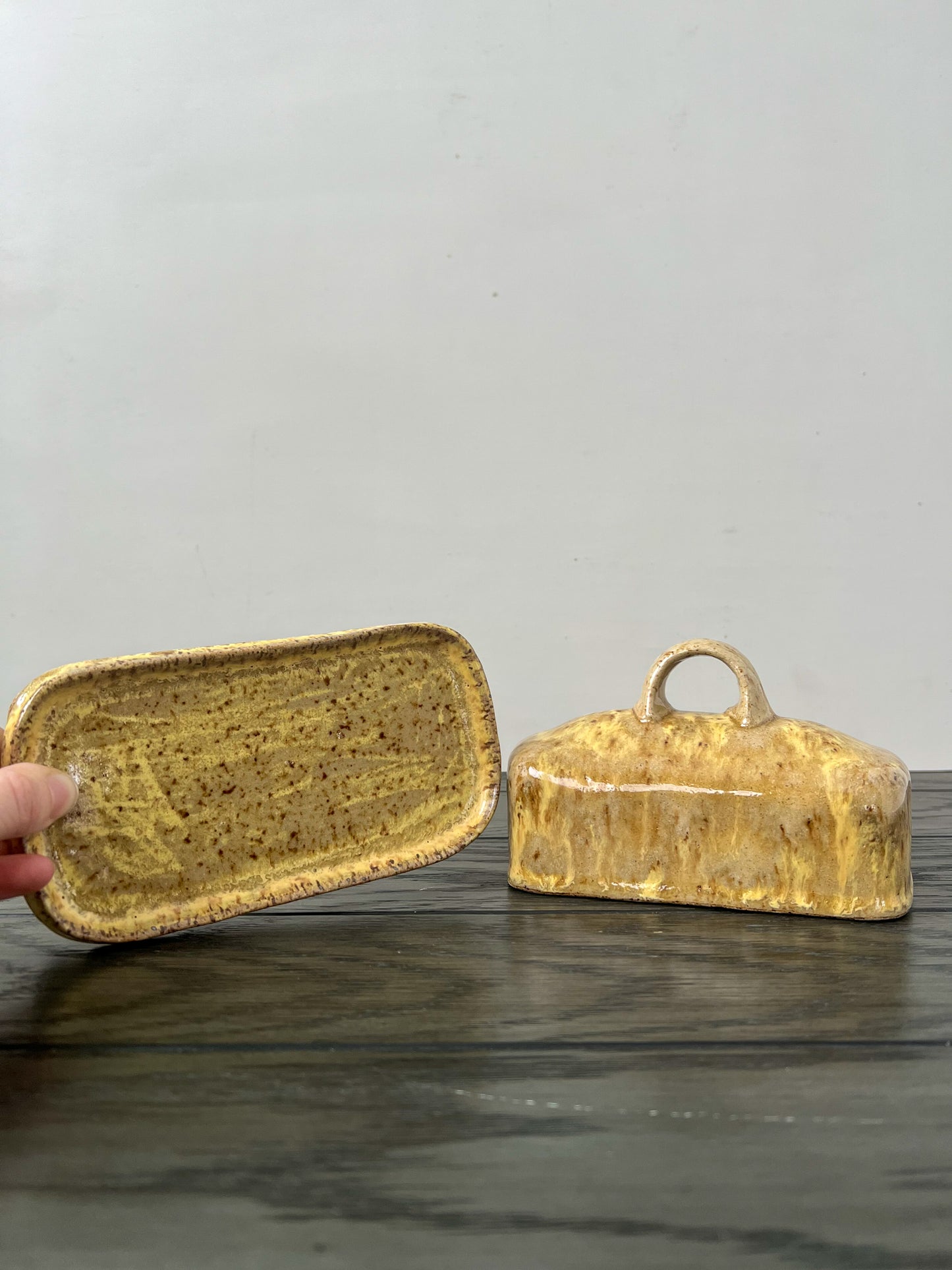 runny yellow speckled butter dish