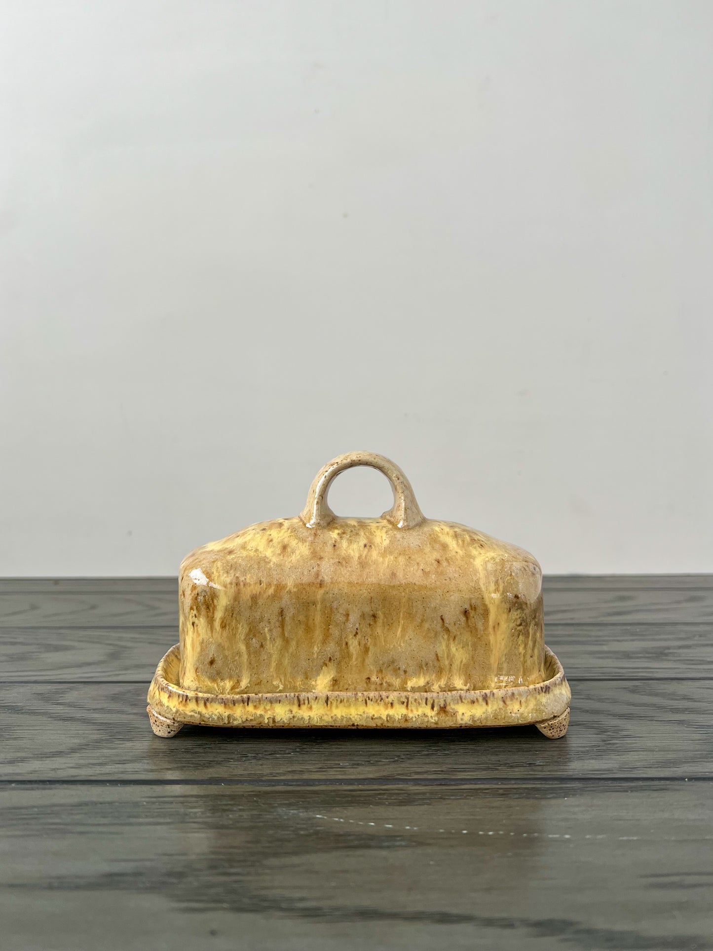 runny yellow speckled butter dish