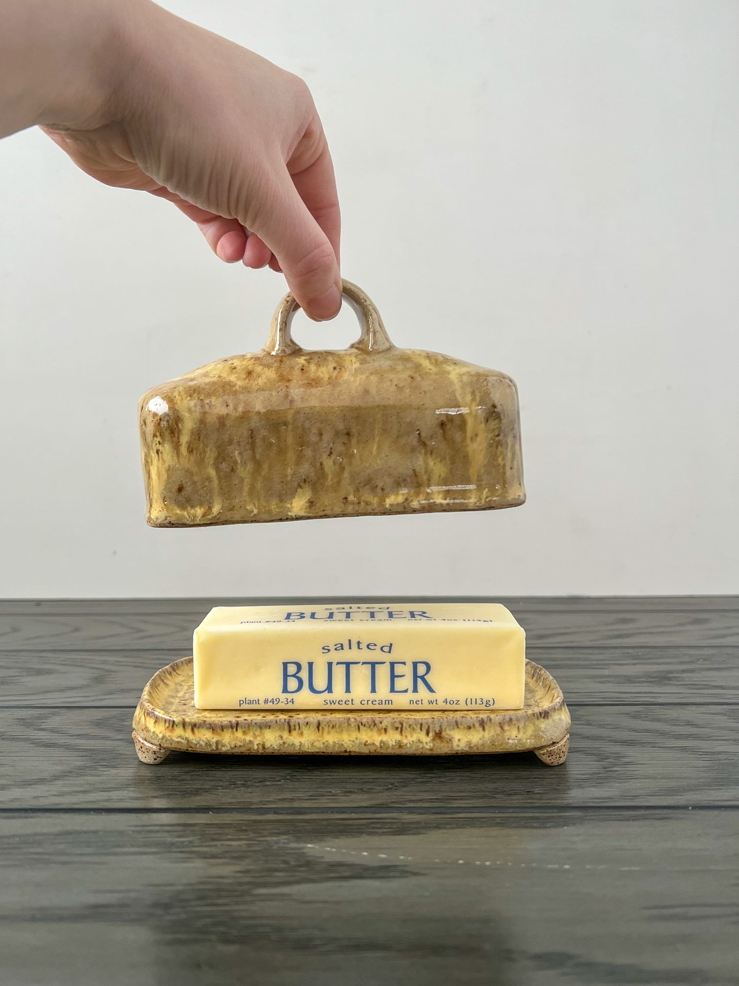 runny yellow speckled butter dish